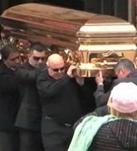 Gangland killer is buried in gold coffin